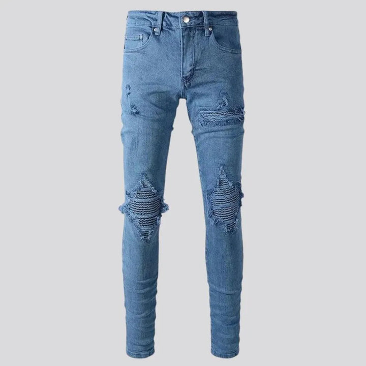 Distressed mid rise men's jeans