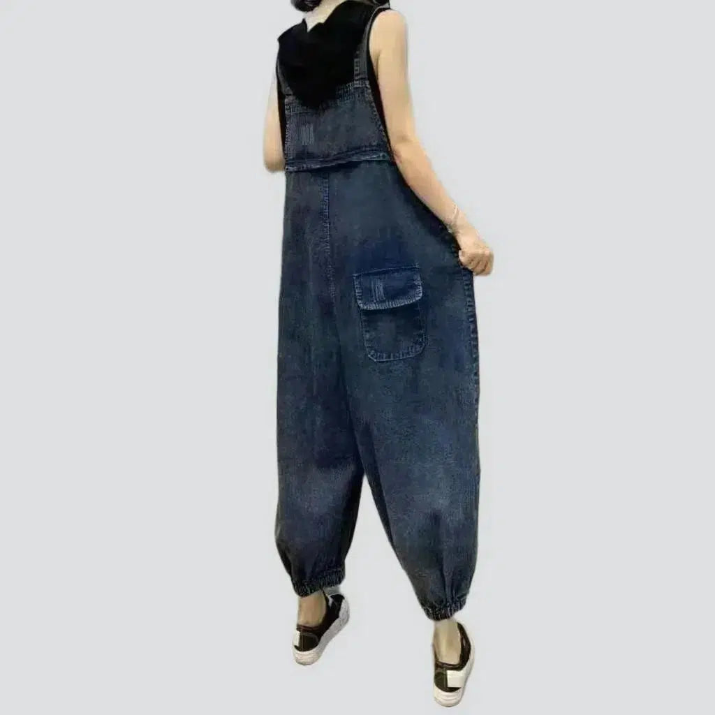 Ripped women's denim jumpsuit