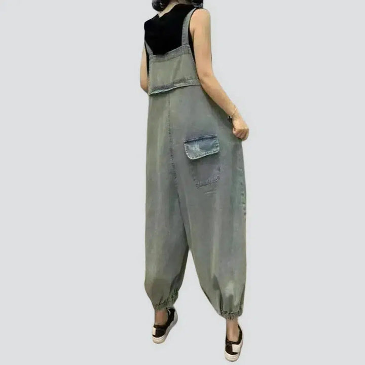 Ripped women's denim jumpsuit