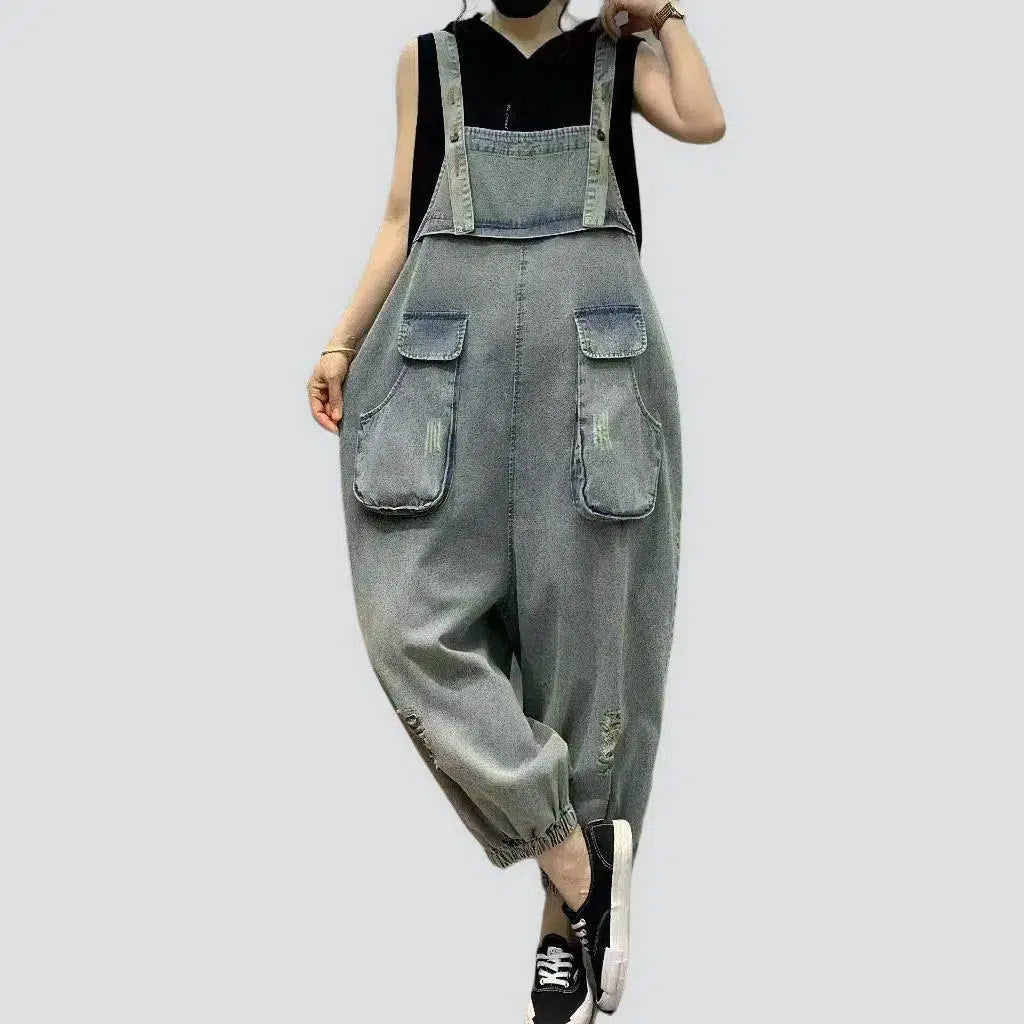 Ripped women's denim jumpsuit