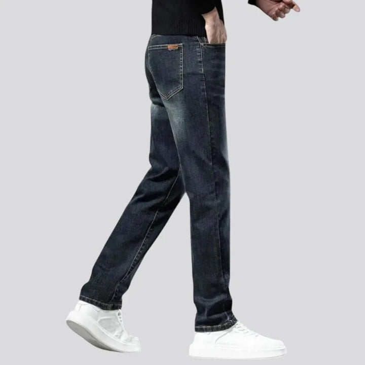 Stretchable dark fading jeans for men