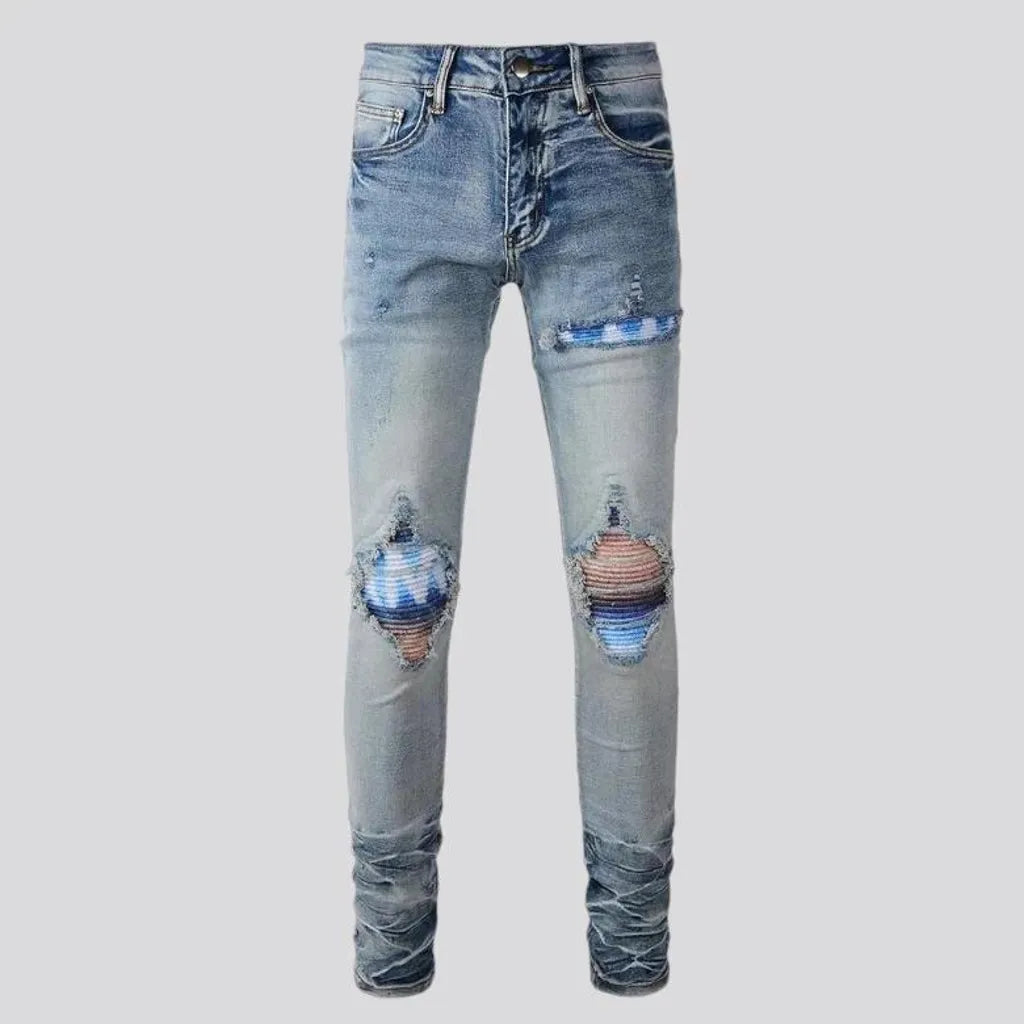 Distressed vintage mid-rise riding men's jeans