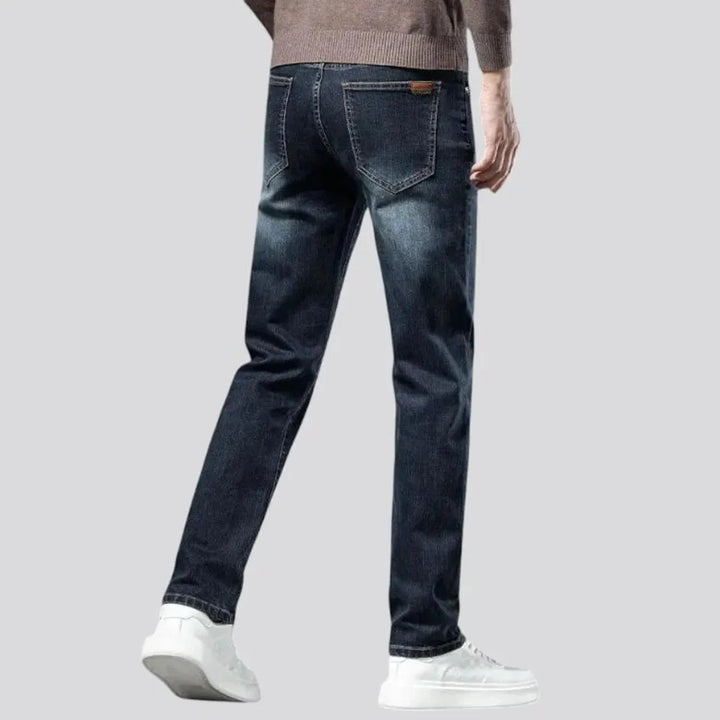 Stretchable dark fading jeans for men