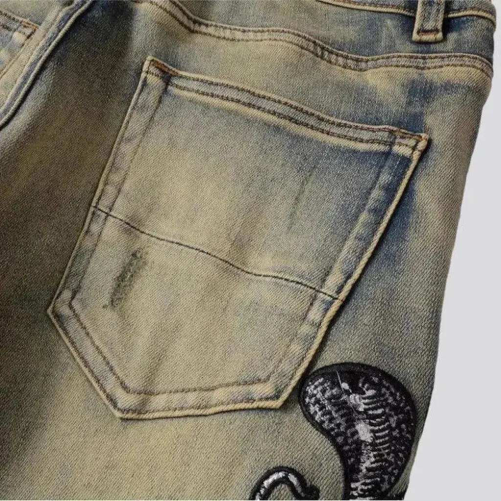Mid-waist cobra-embroidery jeans