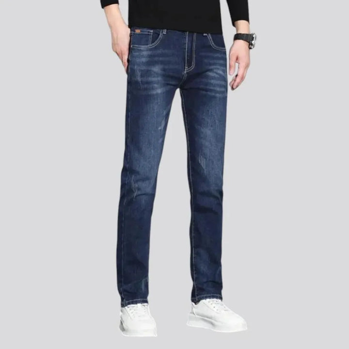 Dark slim-fitting casual men's jeans