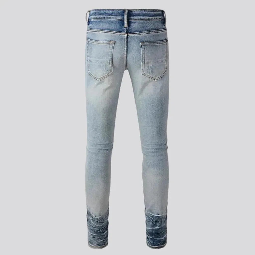 Distressed vintage mid-rise riding men's jeans