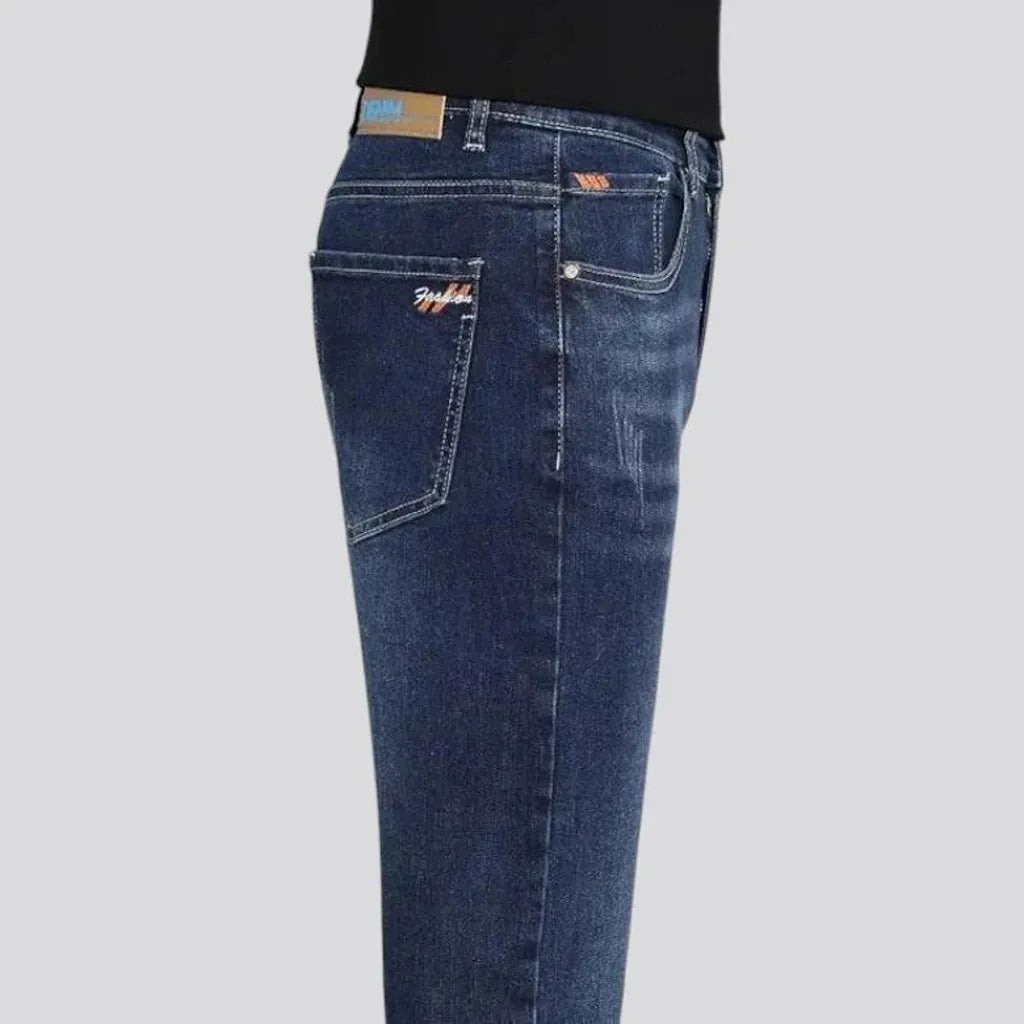 Dark slim-fitting casual men's jeans