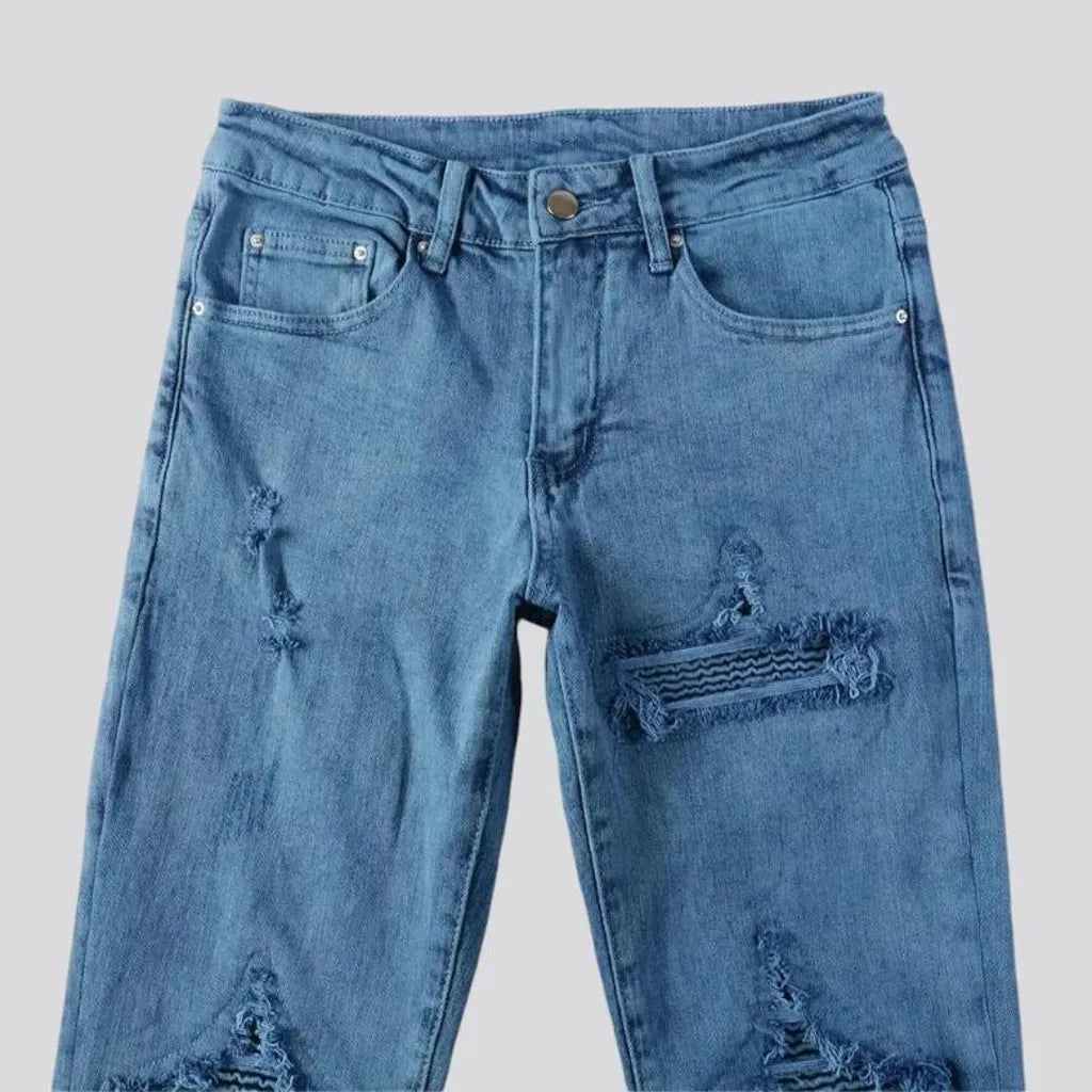 Distressed mid rise men's jeans