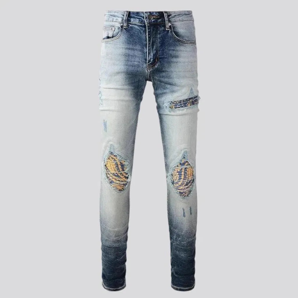 Whiskered mid rise skinny men's jeans