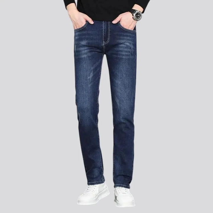 Dark slim-fitting casual men's jeans