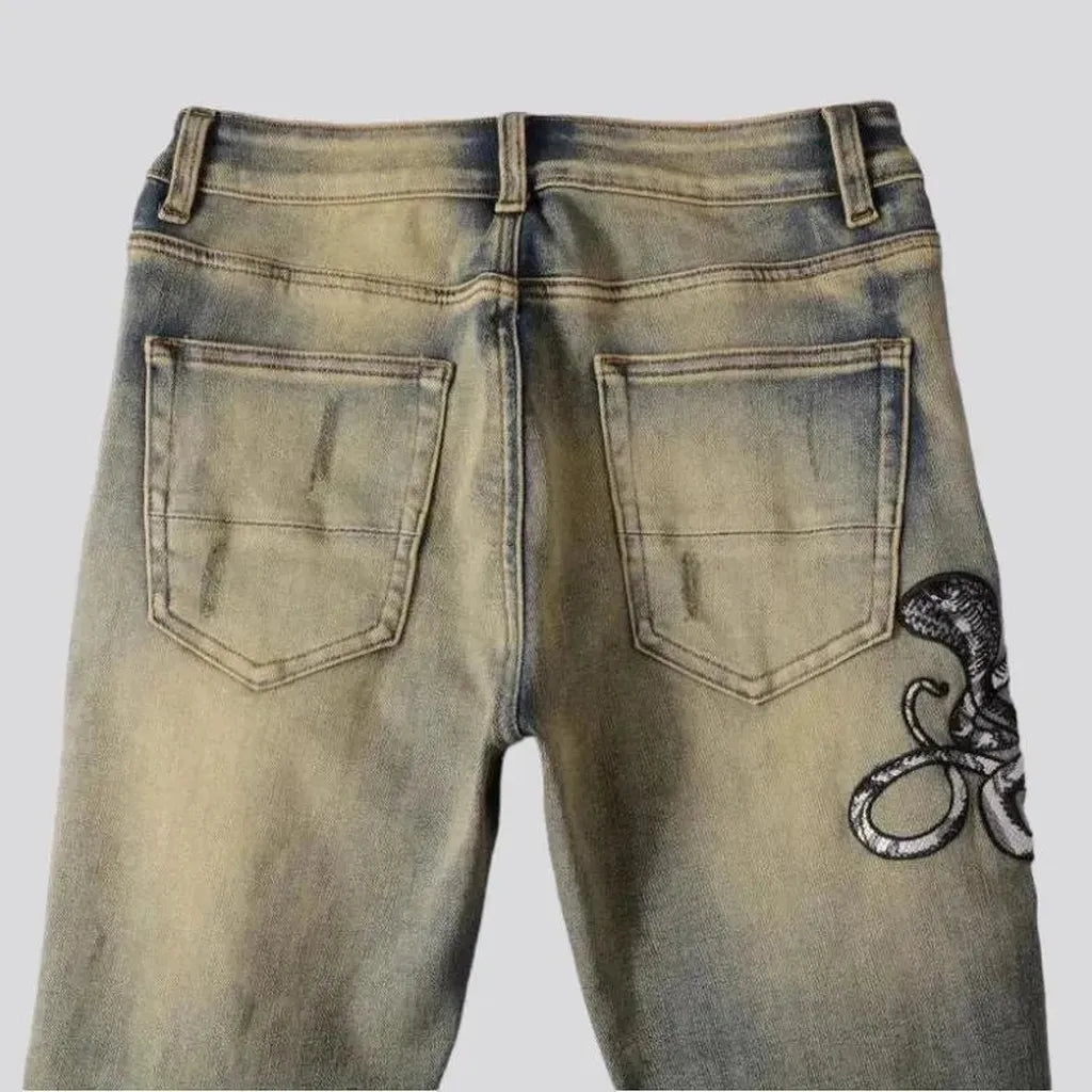 Mid-waist cobra-embroidery jeans