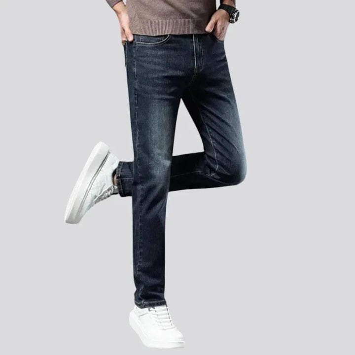 Stretchable dark fading jeans for men