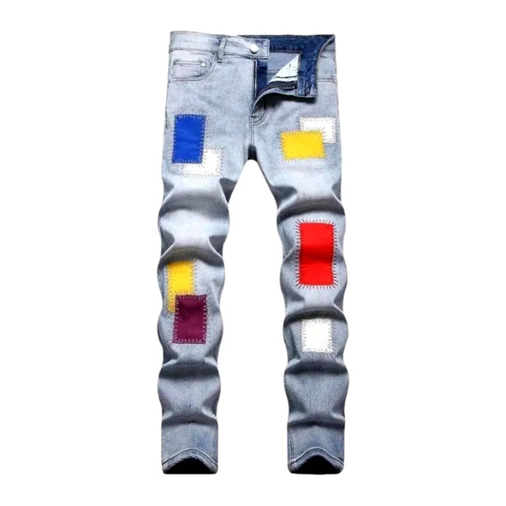 Light-wash color-patches jeans